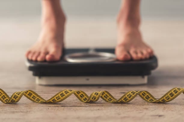 a person standing on a scale